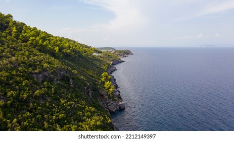 Aerial View From Flying Drone Of People Crowd Relaxing On Beach In Greece.