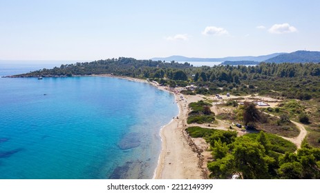 Aerial View From Flying Drone Of People Crowd Relaxing On Beach In Greece.