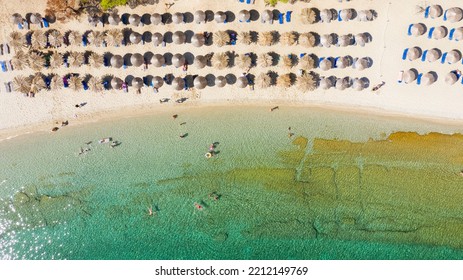 Aerial View From Flying Drone Of People Crowd Relaxing On Beach In Greece.