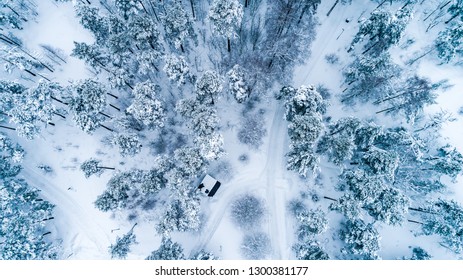 aerial view of forest covered with snow ,Snow covered winter road,bird's eye view