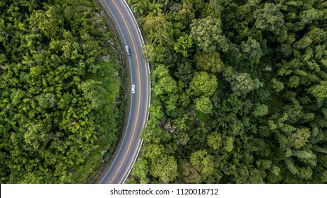 Aerial view of forest road at South East Asia, Aerial view of a provincial road passing through a forest, Ecosystem and healthy environment concepts and background, Thailand.