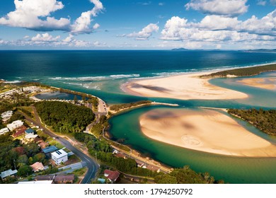 Aerial View Forster Beach NSW Australia from Nambucca Heads Captain Cook Lookout Sunny Day with Clouds Above River Mouth White Sand Waves Breaking Holiday Destination Caravan Park Green Water