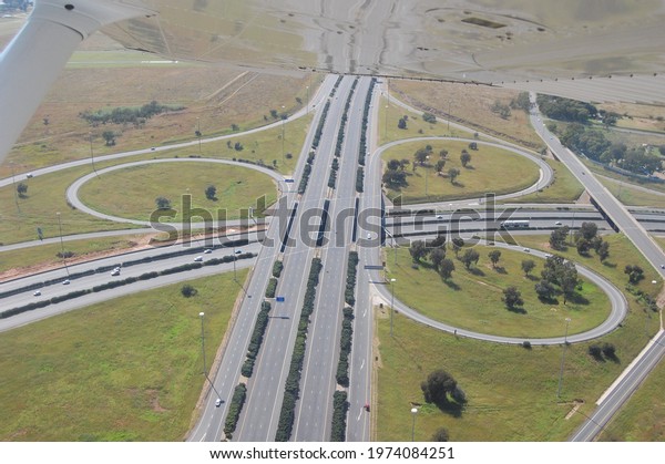 Aerial view of a freeway intersection in\
Johannesburg, South Africa.  I shot this close to the Rand Airport\
in South Africa.