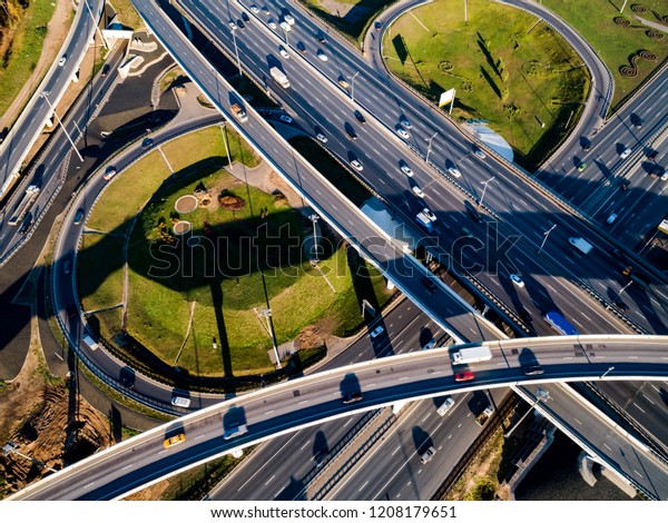 Aerial view of a freeway intersection traffic\
trails in Moscow.