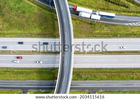 Aerial view of the freeway with various connections. Vehicles travel on the roads. Poland