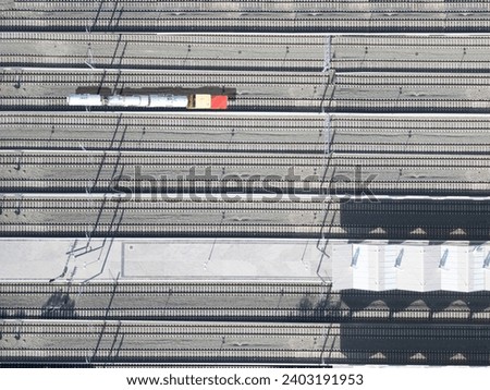 Aerial view of a freight train carrying chemicals in tank cars.