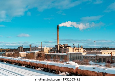 Aerial View Of Freight Train. Railway Station With Wagons. Heavy Industry. Industrial Landscape With Train In Depot, Chimney With Smoke Stack, Factory Buildings. 