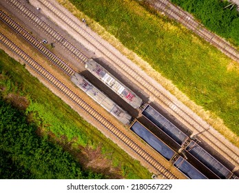 Aerial View Of Freight Train Wagons On Large Railway Track Field. Concept Of Modern Logistics. Coal Delivery