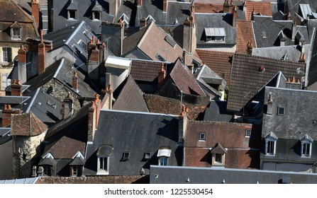 Aerial view of a French town with roofs and chimneys