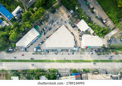 Aerial View Of Fresh Market Building Beside Road And Customer Vehicle On Car Park In Amphur Sansai Of Chiang Mai, Thailand.