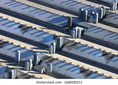 Aerial View Of A Frost Covered Chicken Farm In The UK. An Aerial Photograph Showing A Large Chicken Farm In The UK. It Was Taken From A Helicopter On A Cold Frosty Day With Low Winter Shadows.