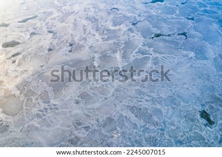 Aerial view of the frozen lake in winter