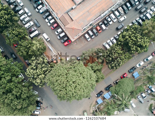 Aerial view of full car\
park.