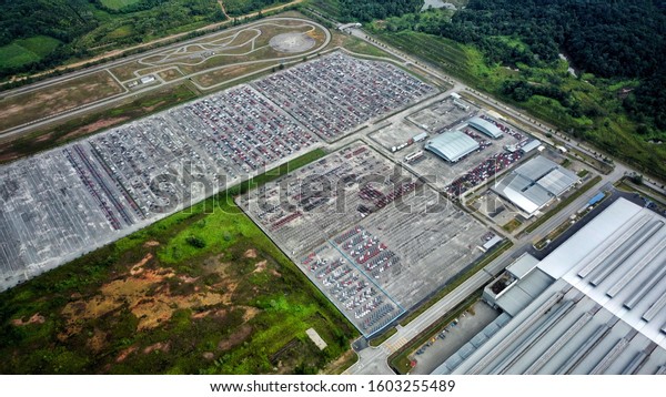 Aerial view of a full parking lot with cars\
captured by drone.