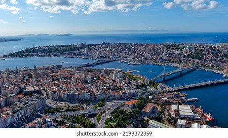 Aerial View Of Galata Tower And Old City Of Istanbul, Turkey Ft. Karakoy And Eminonu Districts From Above And Historic Neighborhood From Ottoman Empire With Bridges On The Golden Horn Waterway