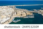 Aerial view of Gallipoli, drone view at the old town with fort, ramparts and harbor, Lecce province, Salento peninsula, Puglia, south Italy. Gallipoli historic center seen from another perspective.