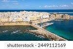 Aerial view of Gallipoli, drone view at the old town with fort, ramparts and harbor, Lecce province, Salento peninsula, Puglia, south Italy. Gallipoli historic center seen from another perspective.