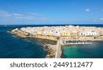 Aerial view of Gallipoli, drone view at the old town with fort, ramparts and harbor, Lecce province, Salento peninsula, Puglia, south Italy. Gallipoli historic center seen from another perspective.