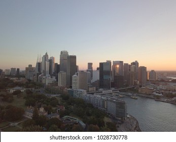 Aerial View Of Generic Cityscape Skyline At Sunset, Bird Eye View Of Sydney Horbour City Architecture In Australia