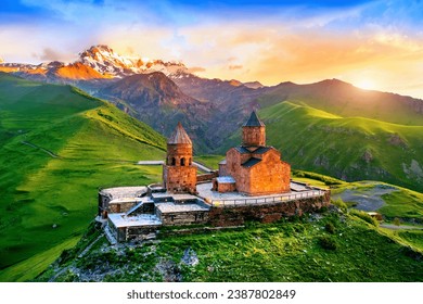 Aerial view of Gergeti trinity church at sunrise in Georgia. - Powered by Shutterstock