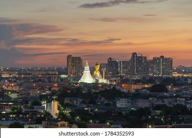 Aerial view of the Giant Golden Buddha in Wat Paknam Phasi Charoen Temple in Phasi Charoen district on Chao Phraya River at night, Bangkok. Urban town, Thailand. Downtown City.