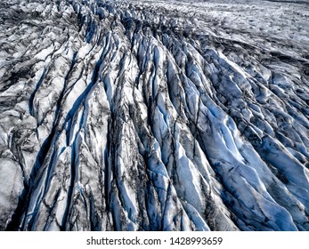 Aerial view of glacier from above, ice and ashes of the volcano texture landscape, beautiful nature ice background from Iceland
