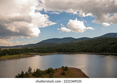 Aerial View Of Golden Pine Forest And Lake At Zlatibor Mountain In Serbia, Shot From Gondola Or Cable Car. Scenic View Of Zlatibor Mountain.