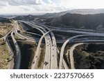 Aerial view of the Golden State 5 and Antelope Valley 14 freeway interchange bridges near Newhall in Los Angeles County, California.