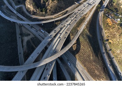 Aerial view of the Golden State 5 and Antelope Valley 14 freeway interchange ramps and bridges near Newhall in Los Angeles County, California.