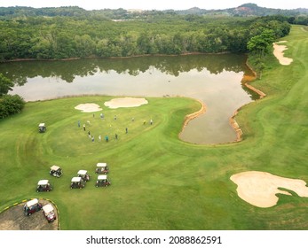 Aerial view of golf course and lagoon in Batam