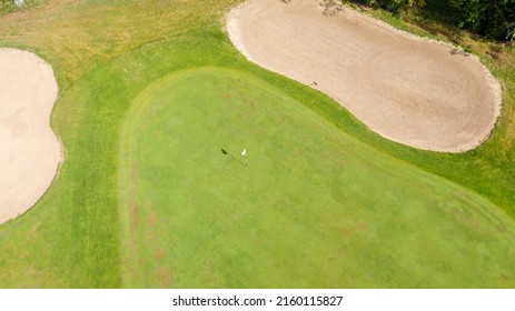 Aerial View Of A Golf Course In The Morning. There Are No People On The Putting Green.