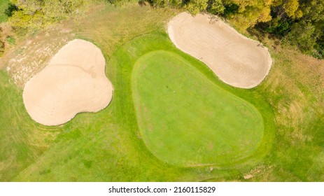 Aerial View Of A Golf Course In The Morning. There Are No People On The Putting Green.