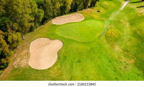 Aerial View Of A Golf Course In The Morning. There Are No People On The Putting Green.