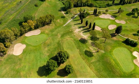 Aerial View Of A Golf Course In The Morning. There Are No People On The Putting Green.