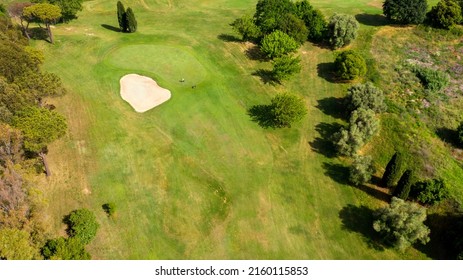 Aerial View Of A Golf Course In The Morning. There Are No People On The Putting Green.