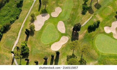 Aerial View Of A Golf Course In The Morning. There Are No People On The Putting Green.