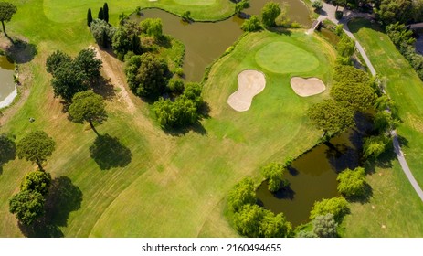 Aerial View Of A Golf Course In The Morning. There Are No People On The Putting Green.