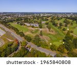 Aerial view of a golf course and Veterans Memorial Pkwy with historic city at the background in East Providence, Rhode Island RI, USA. 