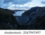 An aerial view of the Gordon Dam on a cool summer