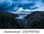 An aerial view of the Gordon Dam on a cool summer