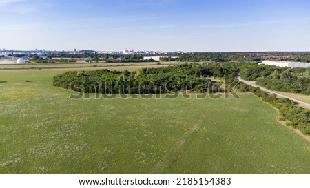 Aerial view of a grass field and trees in south Germany near Munich