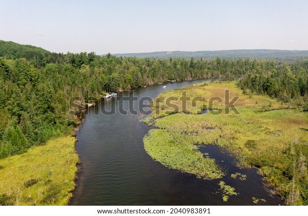Aerial view of the Grass river in Bellaire\
Michigan This river connects Lake Bellaire and the Clam Lake.\
Photograph was taken in the Summertime in the late afternoon. Drone\
Photography from Above.