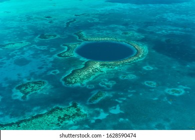 Aerial View Of The Great Blue Hole And The Coral Reefs At The Coast Of Belize