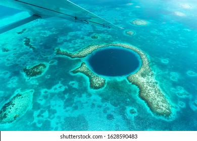 Aerial View Of The Great Blue Hole And The Coral Reefs At The Coast Of Belize