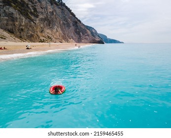 Aerial View Of Greece Beach Woman Floating On Inflatable Ring Copy Space