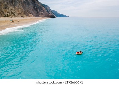 Aerial View Of Greece Beach Woman Floating On Inflatable Ring Copy Space