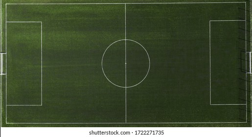 Aerial View Of A Green Football Field At Day Time.