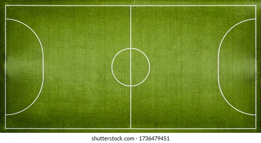 Aerial View Of A Green Football Field At Day Time.