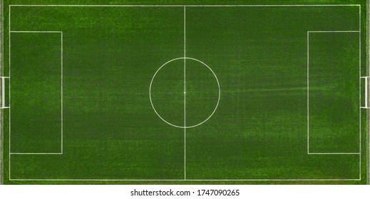 Aerial View Of A Green Football Field At Day Time.