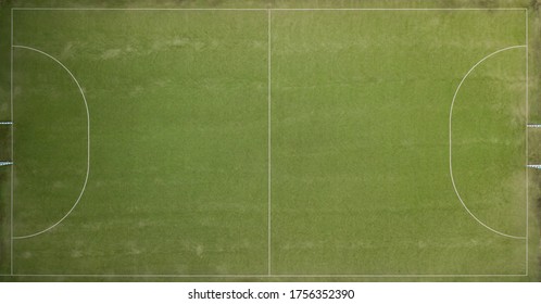 Aerial View Of A Green Football Field At Day Time.